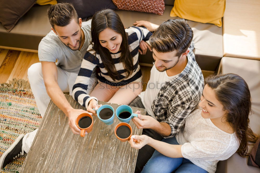 Similar – Happy family at home in the couch playing classic table games