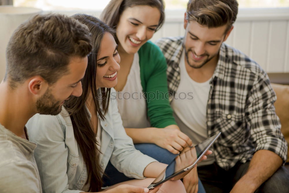 Similar – Happy family at home in the couch playing classic table games