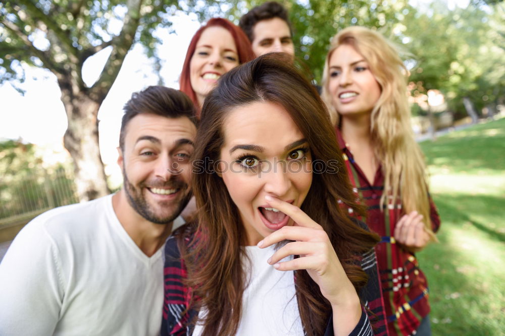 Similar – Group of friends taking selfie in urban park