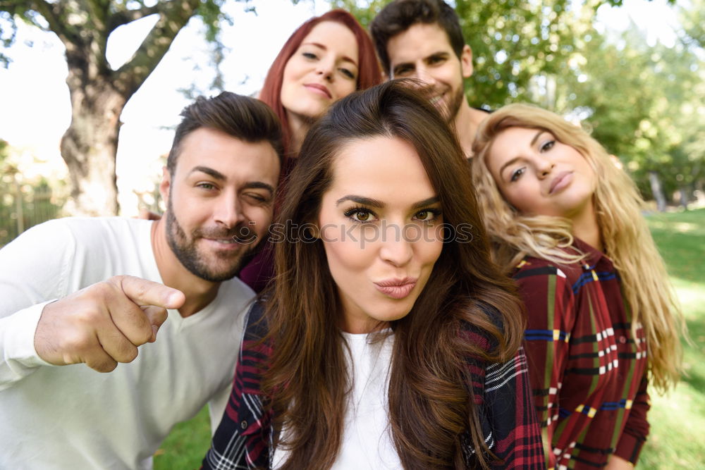 Similar – Group of friends taking selfie in urban park