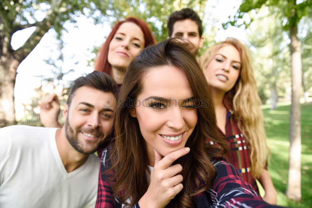 Similar – Group of friends taking selfie in urban park