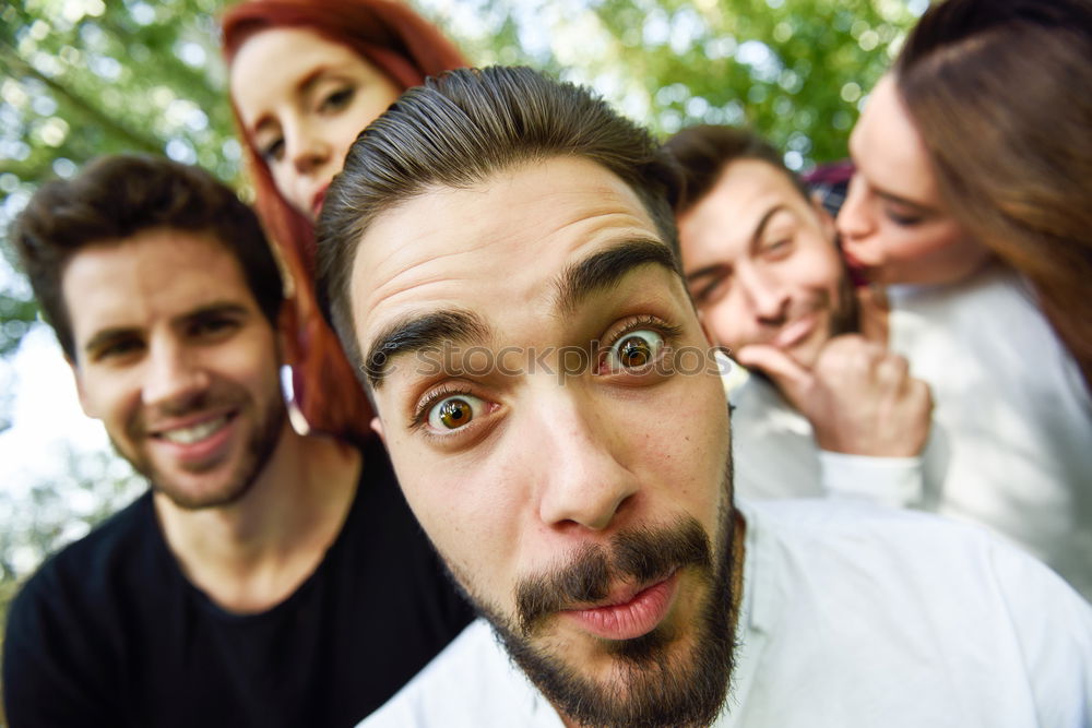 Similar – Group of friends taking selfie in urban park