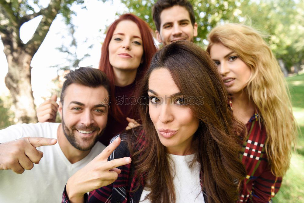 Similar – Group of friends taking selfie in urban park