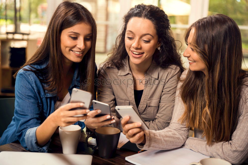 Similar – Multi-ethnic group of people looking at a tablet computer