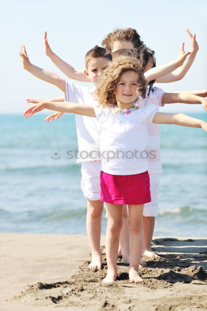 Similar – Sister and brother playing on the beach