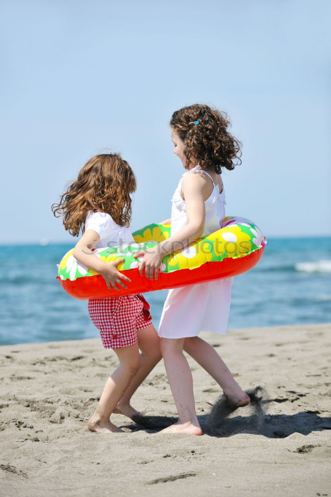 Similar – Two happy children playing on the beach