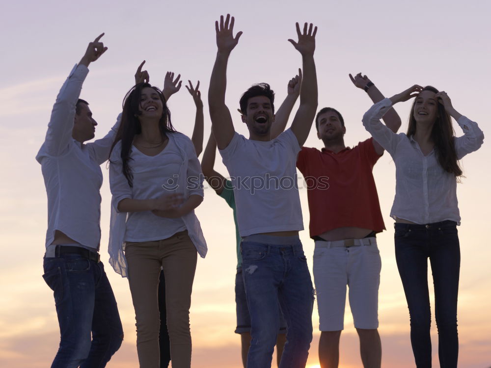 Similar – Multi ethnic group of friends dancing on music festival