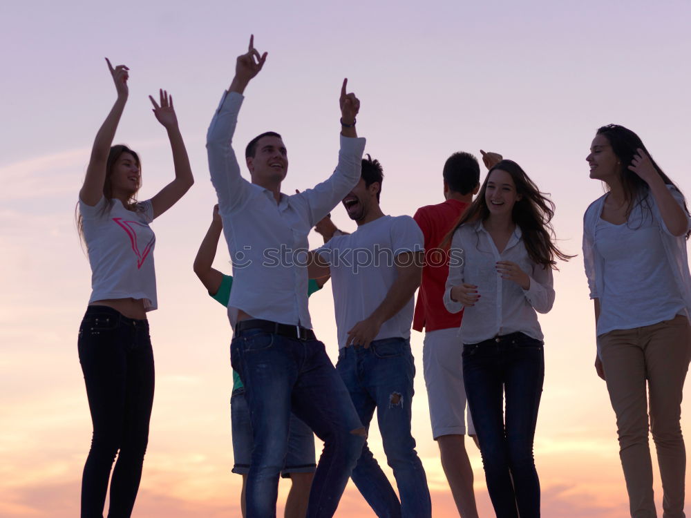 Similar – Multi ethnic group of friends dancing on music festival