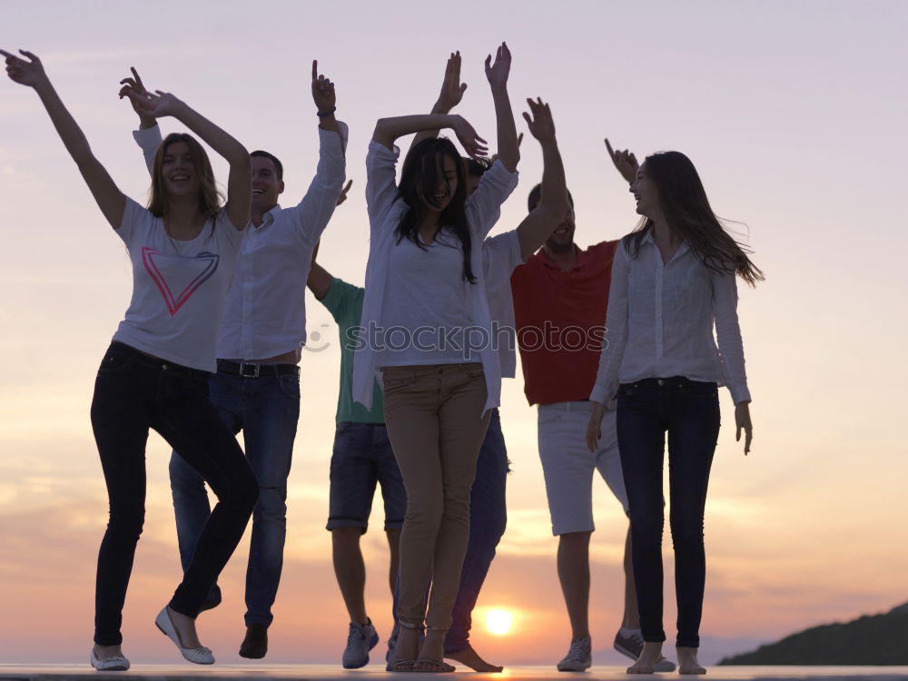 Similar – Image, Stock Photo Group of happy friends celebrating with drinks in sunset