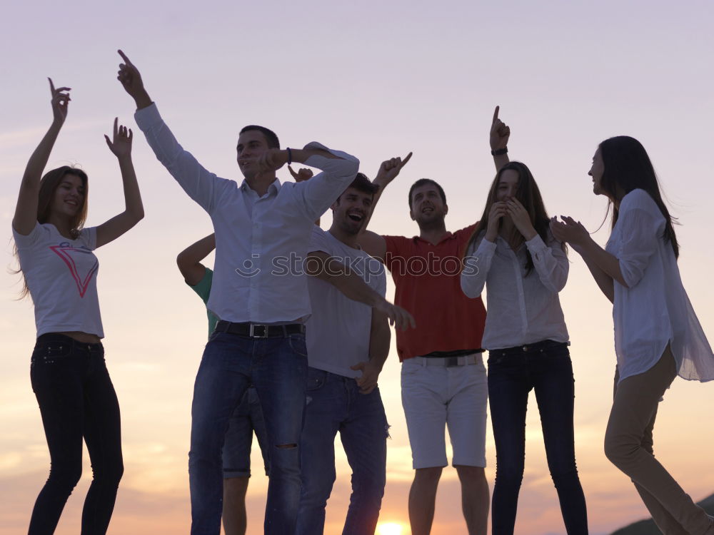 Similar – Multi ethnic group of friends dancing on music festival