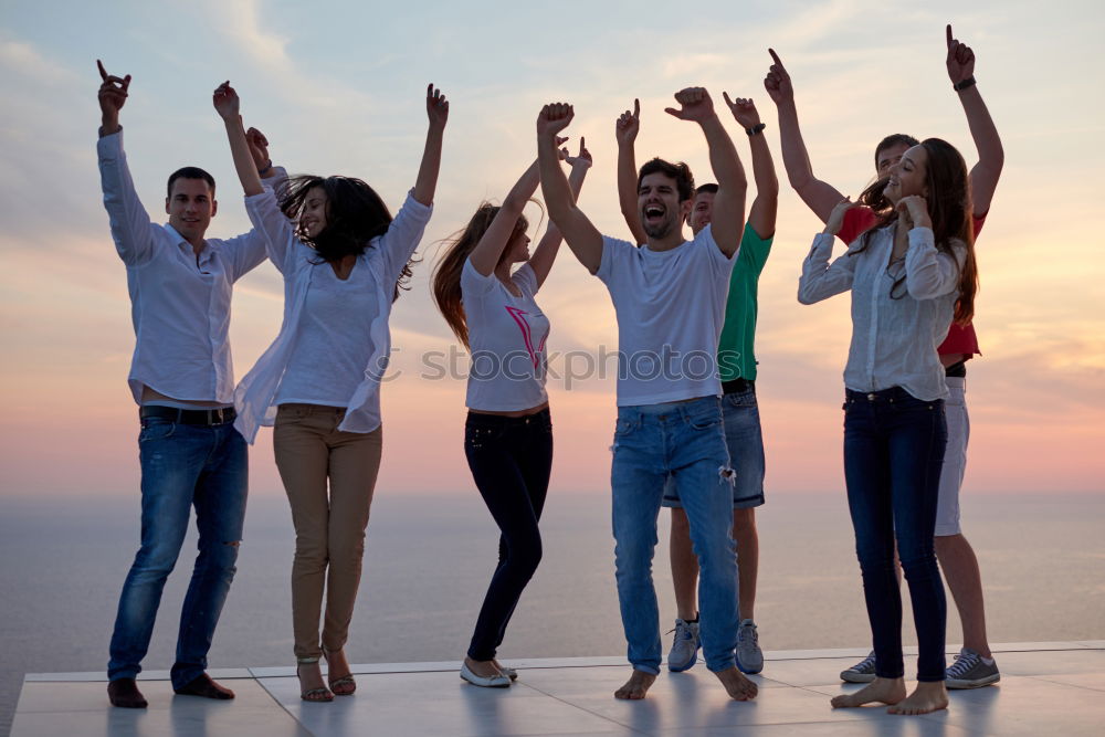 Similar – Multi ethnic group of friends dancing on music festival