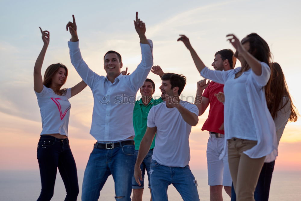 Similar – Multi ethnic group of friends dancing on music festival