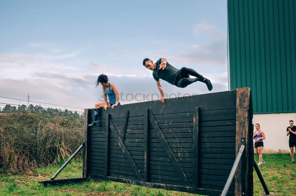 Similar – Man in obstacle course doing irish table