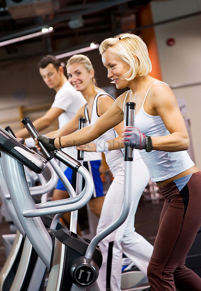 Similar – Concentrated woman in hard bike training session