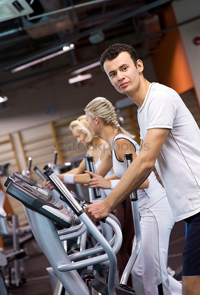 Similar – Image, Stock Photo Couple in a spinning class wearing sportswear.