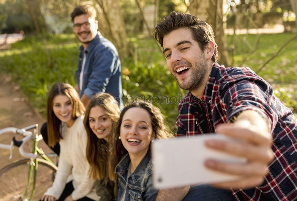 Similar – Group of friends taking selfie in urban park