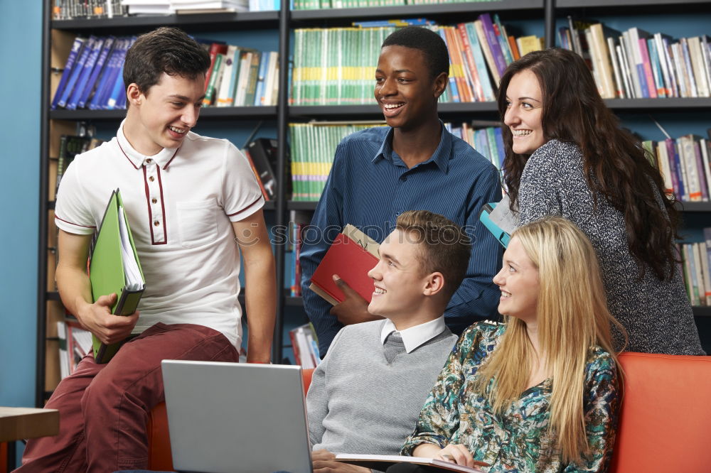 Image, Stock Photo Multi-ethnic group of young people looking at a tablet computer outdoors