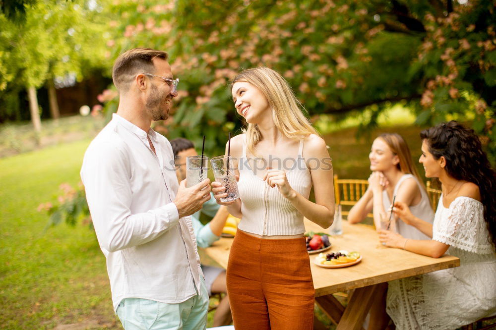 Similar – Cute mixed race couple enjoying wine together on date