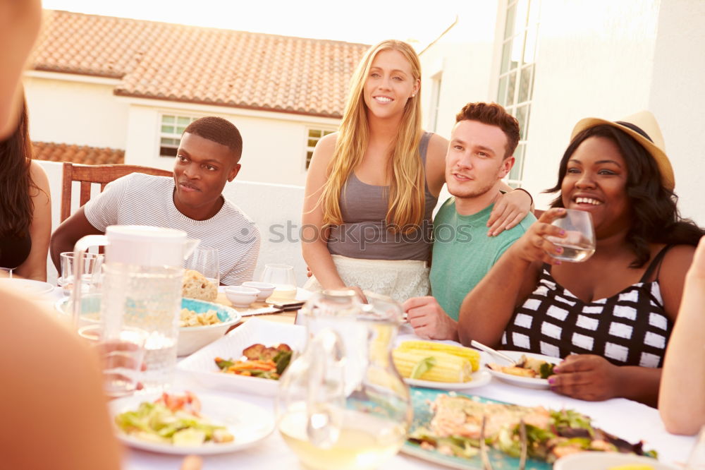 Similar – Cute young adult couple taking photo at outdoor picnic