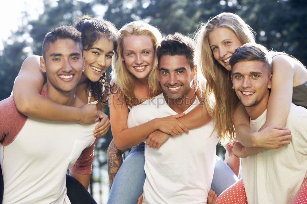 Similar – Group of friends taking selfie in urban background.