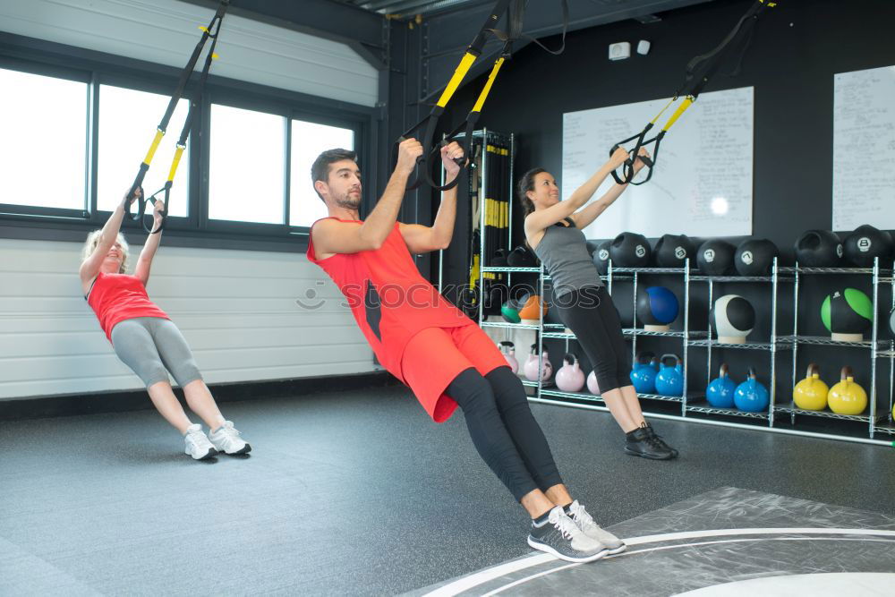 Similar – Image, Stock Photo Couple doing exercises over steps in fitness center