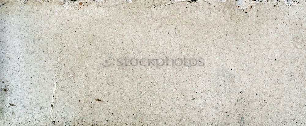 Similar – A piece of white adhesive tape over a crack in the plaster of a house wall