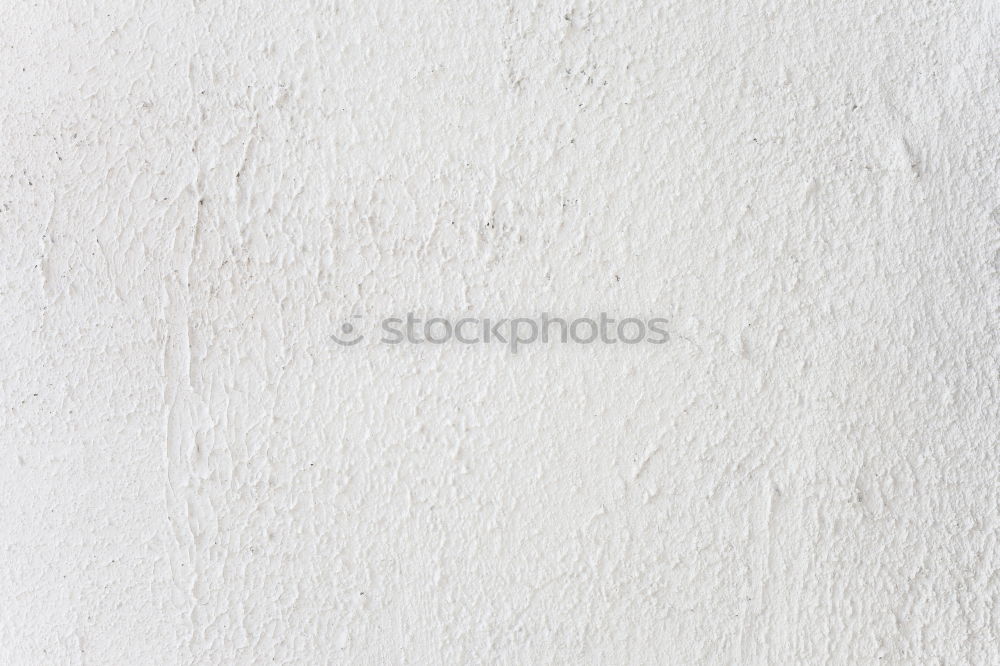 Similar – Painting a rough wall in a white color by paint roller