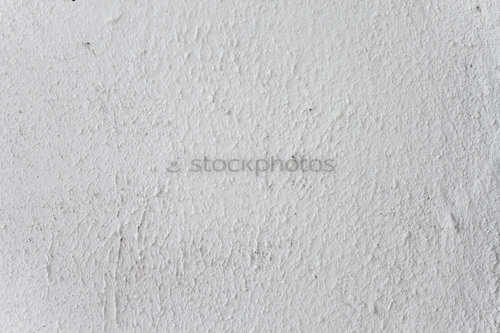 Similar – Painting a rough wall in a white color by paint roller