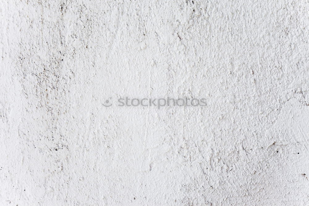 Similar – Painting a rough wall in a white color by paint roller