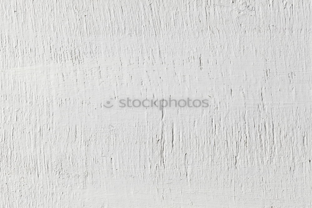 Similar – Painting a rough wall in a white color by paint roller