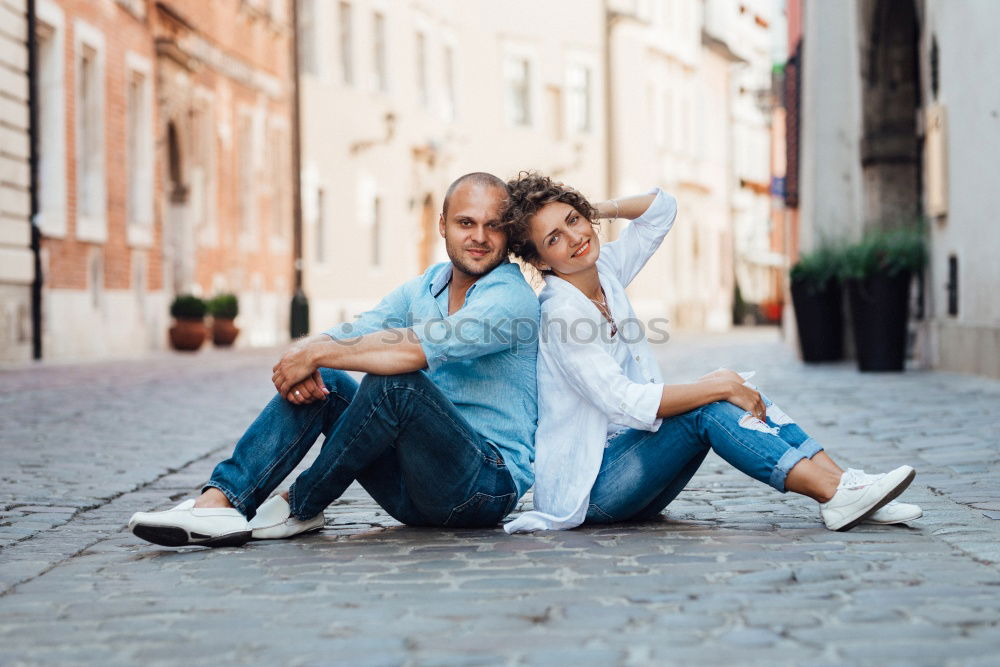 Similar – Happy friends sitting on steps