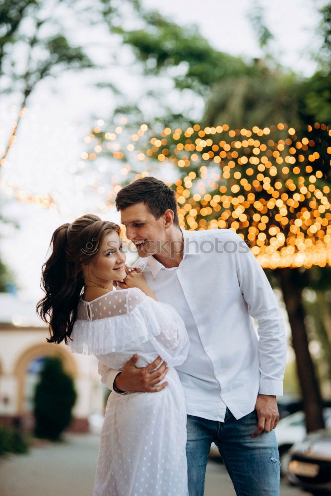 Similar – Image, Stock Photo Young loving couple kissing in the street.