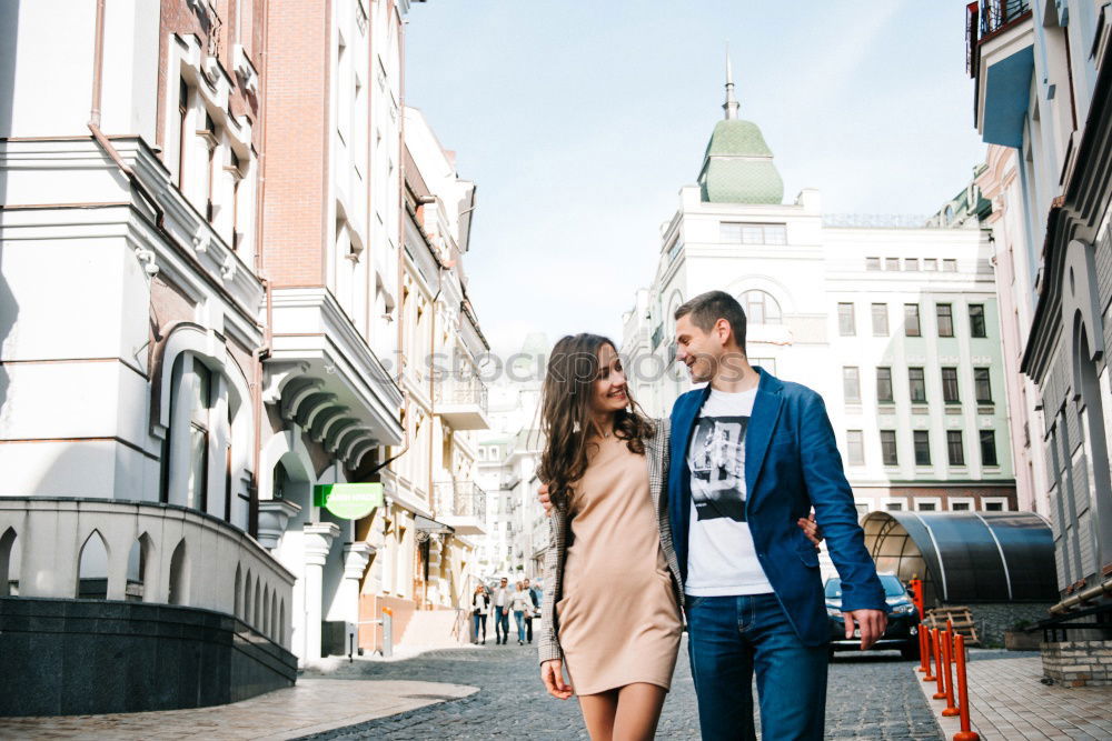 Beautiful couple hugging on crosswalk