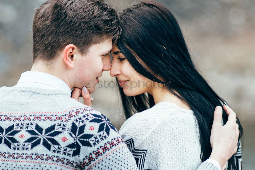 Similar – Woman with gift box in hand embracing and kissing to boyfriend