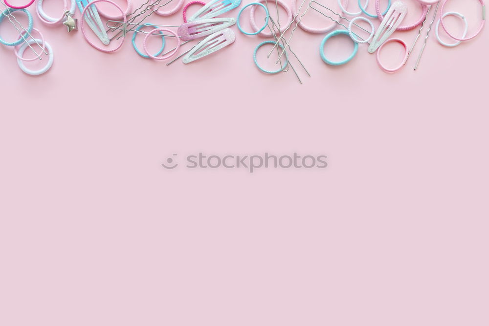 Turquoise tropical leaves and flowers background. Paper tropical leaves on pink background. Creative composing in pastel color with copy space for your design. Banner or template