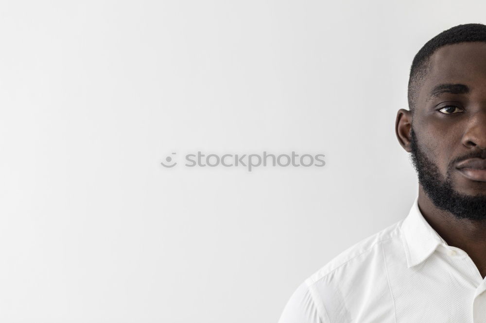 Similar – Handsome afro-american man biting his lip and looking aside in Gran via, Madrid.