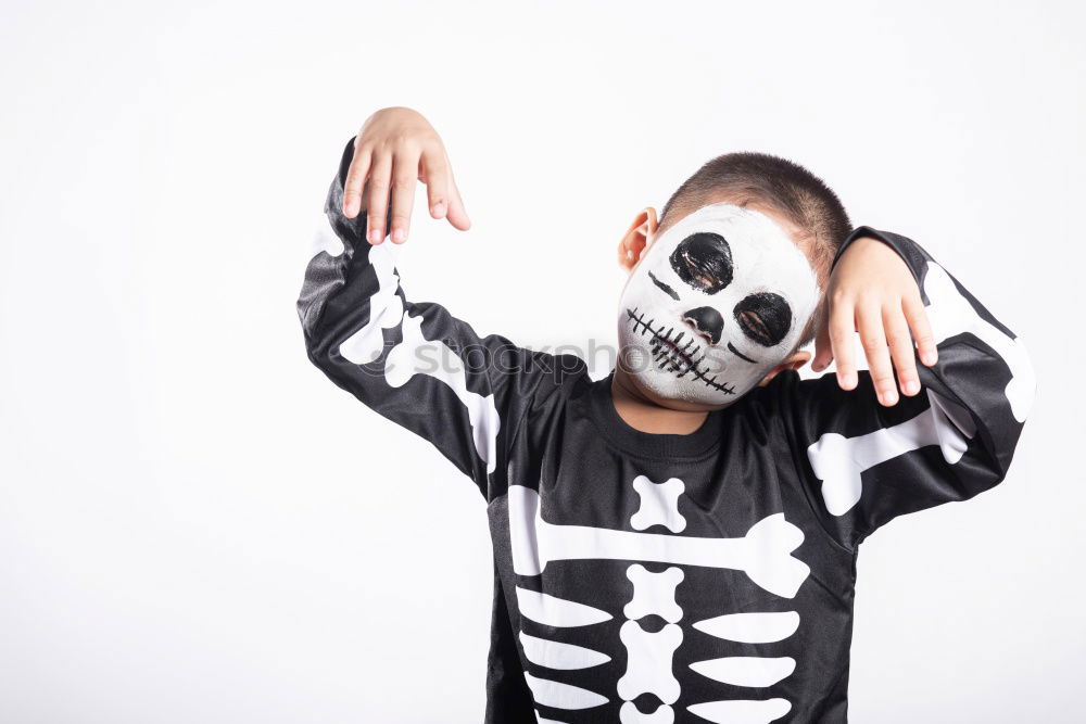 Similar – Little kid in a skeleton costume on Halloween Carnival