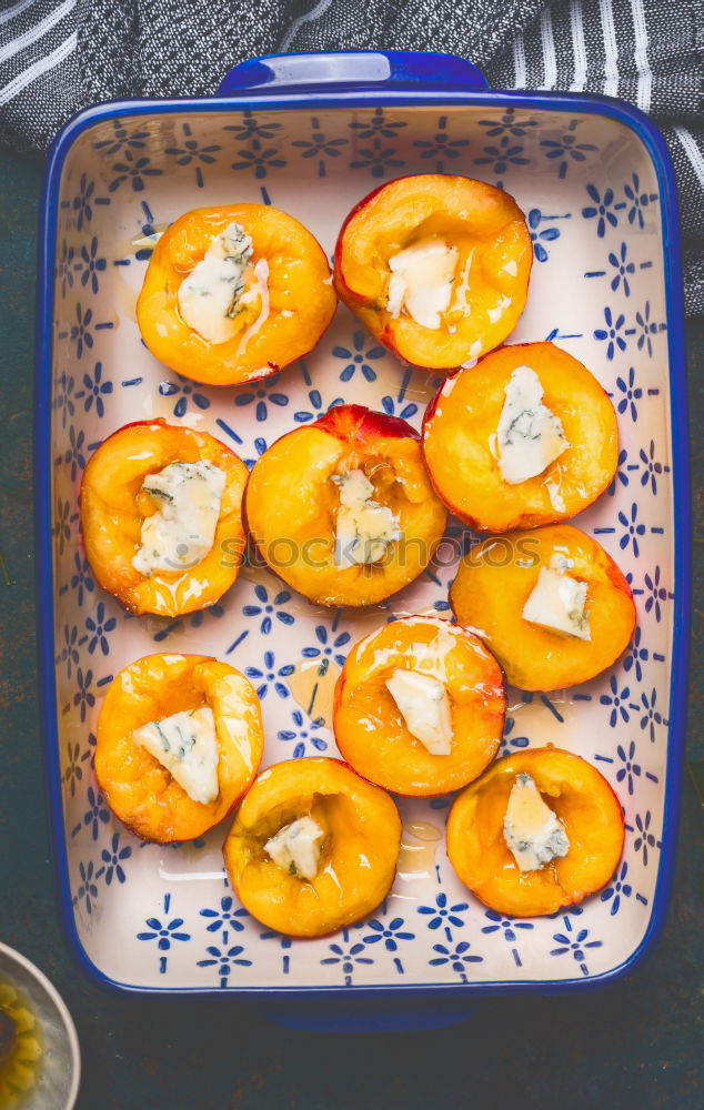 Similar – Image, Stock Photo Casserole dish with peaches and honey