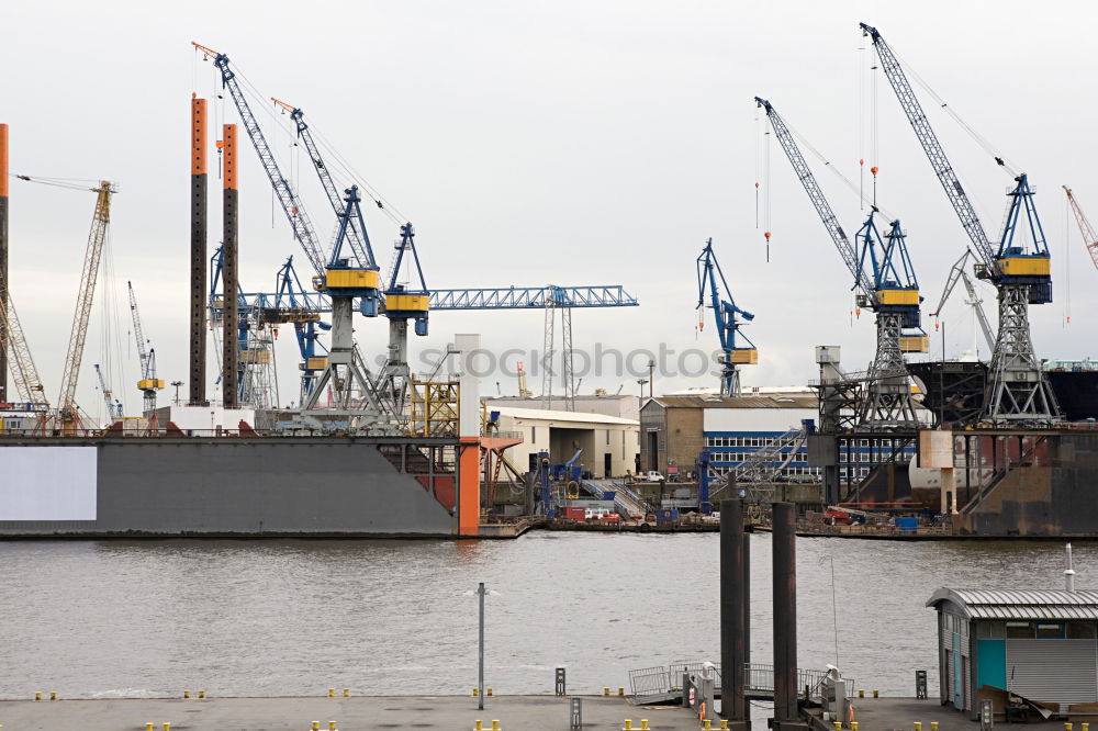 Similar – Pastel evening atmosphere at the harbor basin with cargo cranes