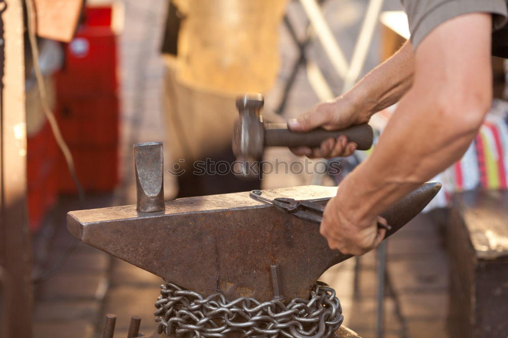 Similar – Hands of woodcarver make wooden bowl