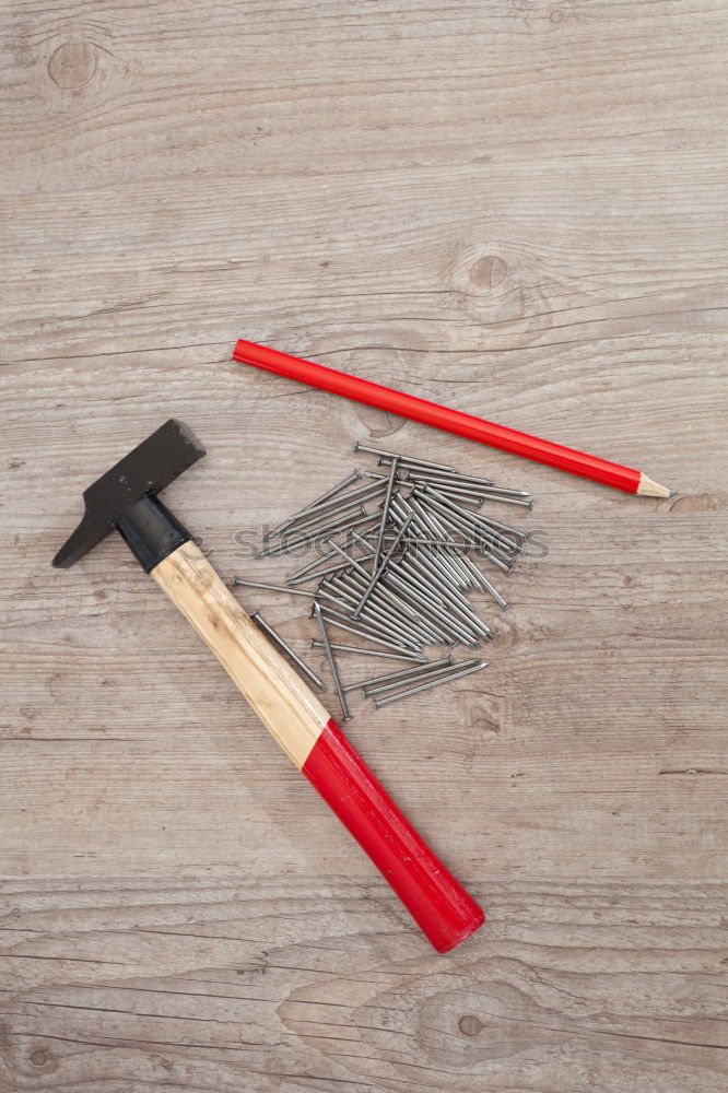 Similar – Pliers and twine on a plank