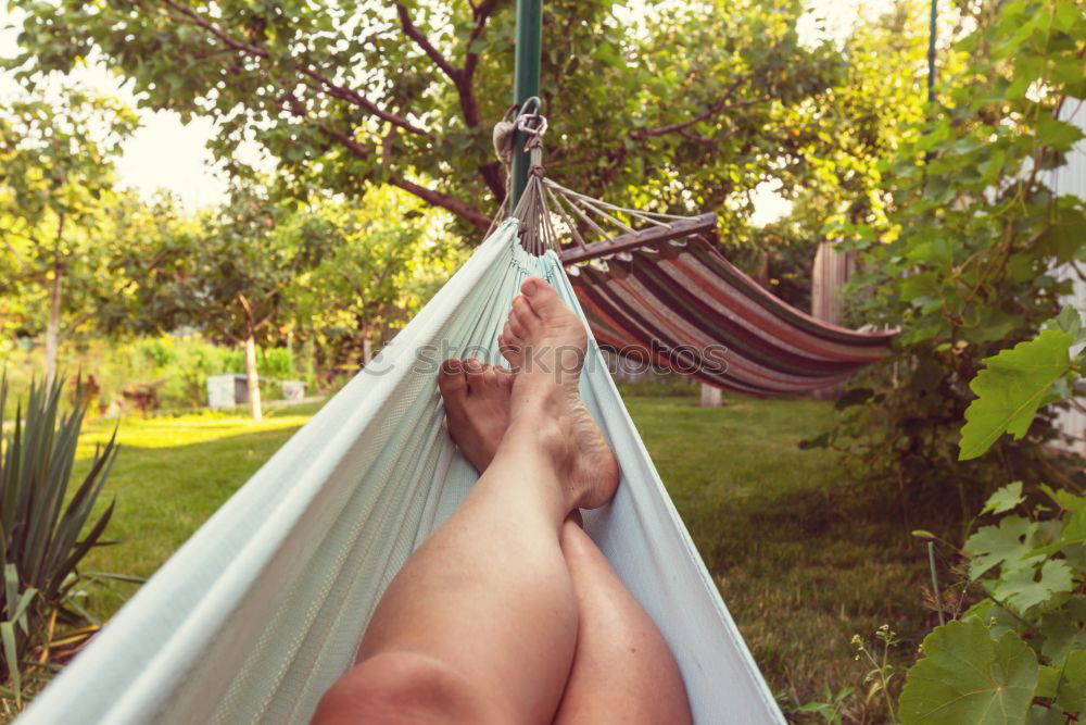 Similar – Young woman relaxing in the hammock in nature