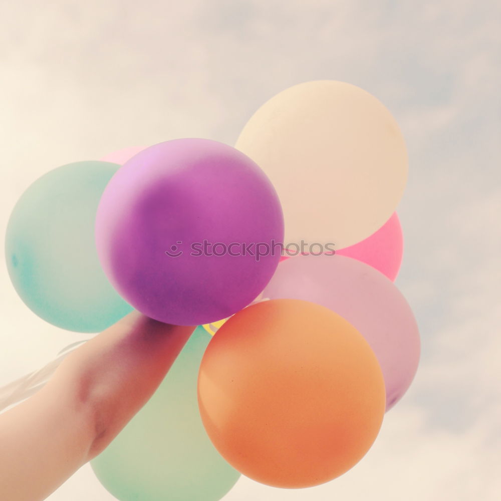 Similar – Image, Stock Photo Hand holding ballooons