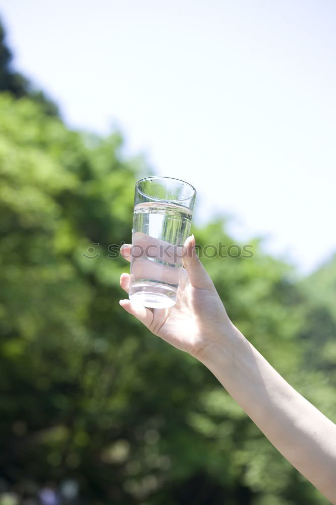 Similar – Image, Stock Photo Hand hold very small cup of coffee.