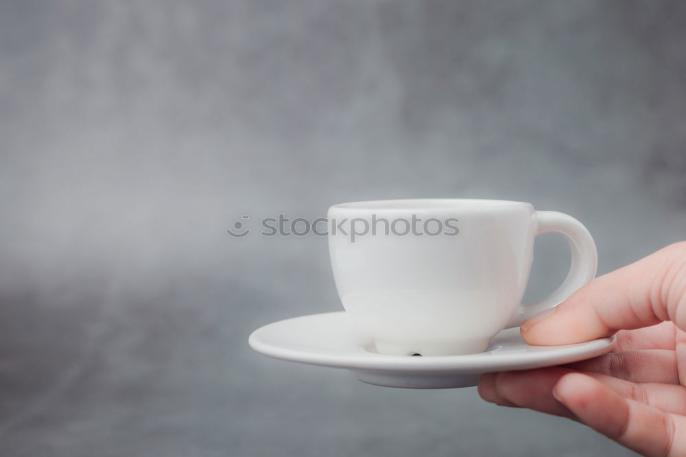 Similar – Image, Stock Photo Turquoise coffee mug held by hands of young woman in yellow pigtail sweater