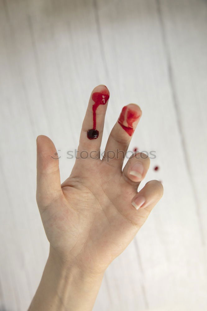 Similar – Finger cut, bleeding injured with knife