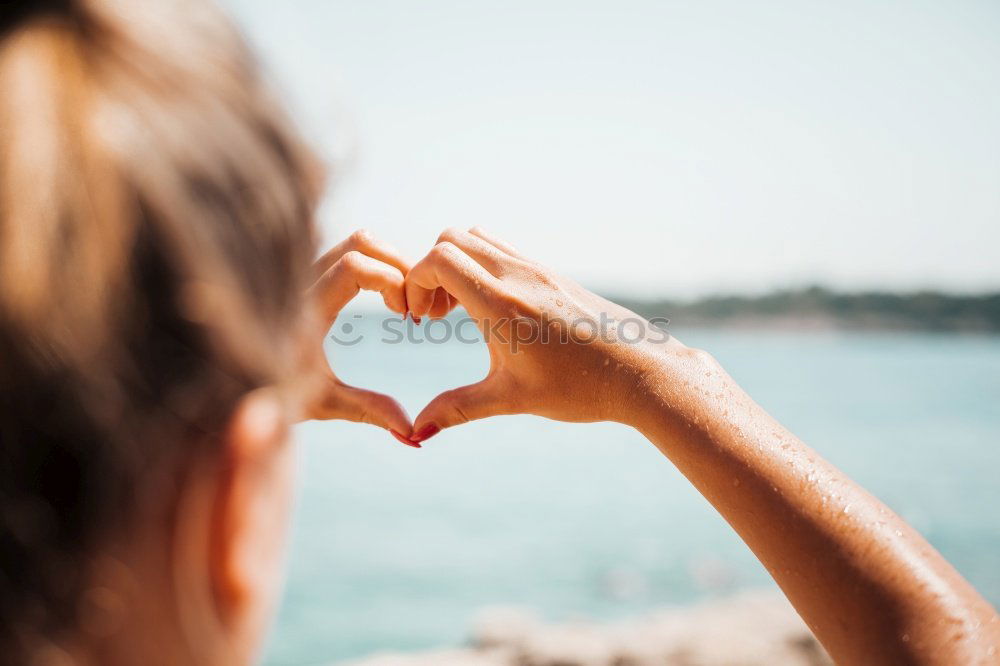 Similar – Image, Stock Photo Woman gesturing heart on street