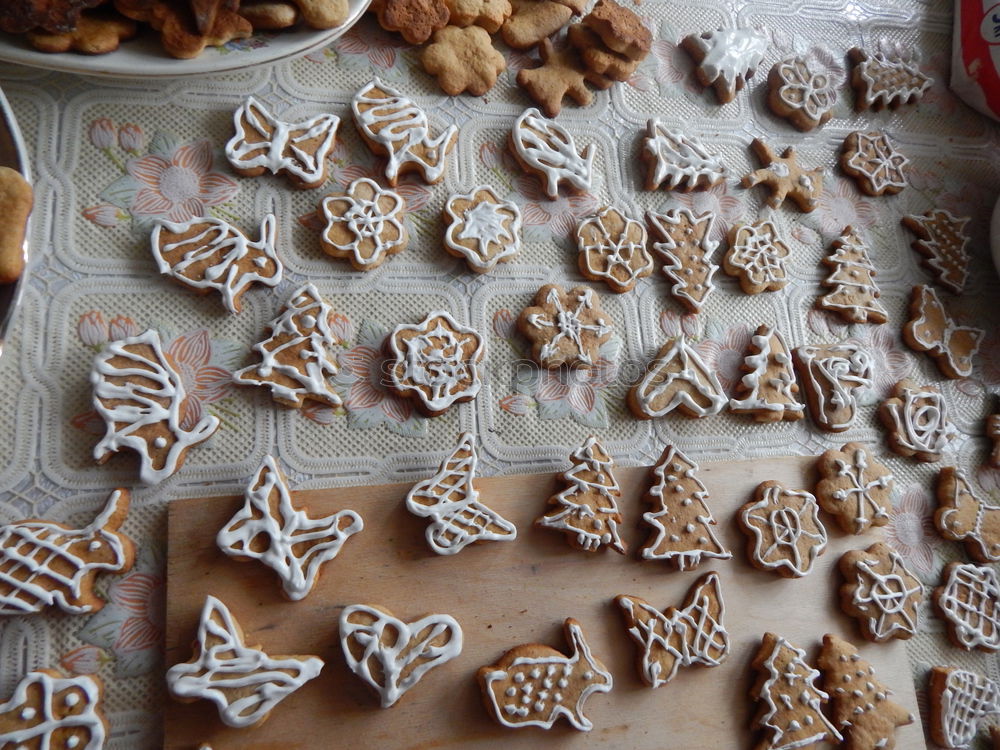 Similar – Cooking Christmas cookies with cookie cutters on a dark table