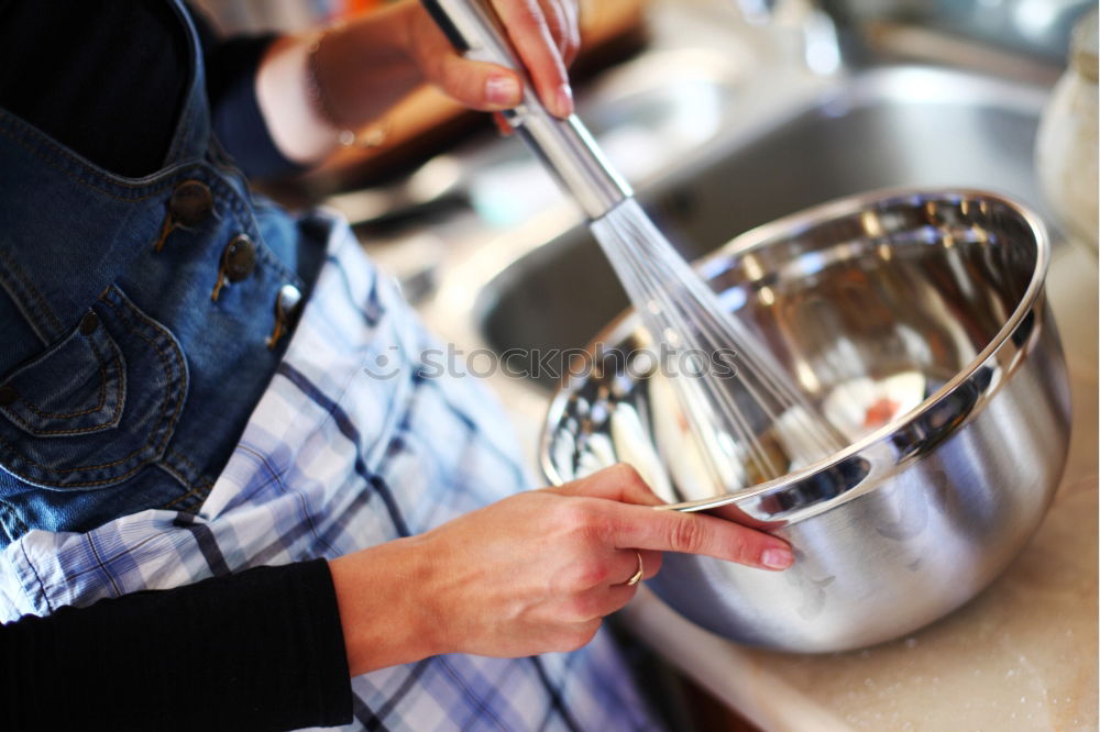 Similar – close up view of woman hand cutting nuts with knife