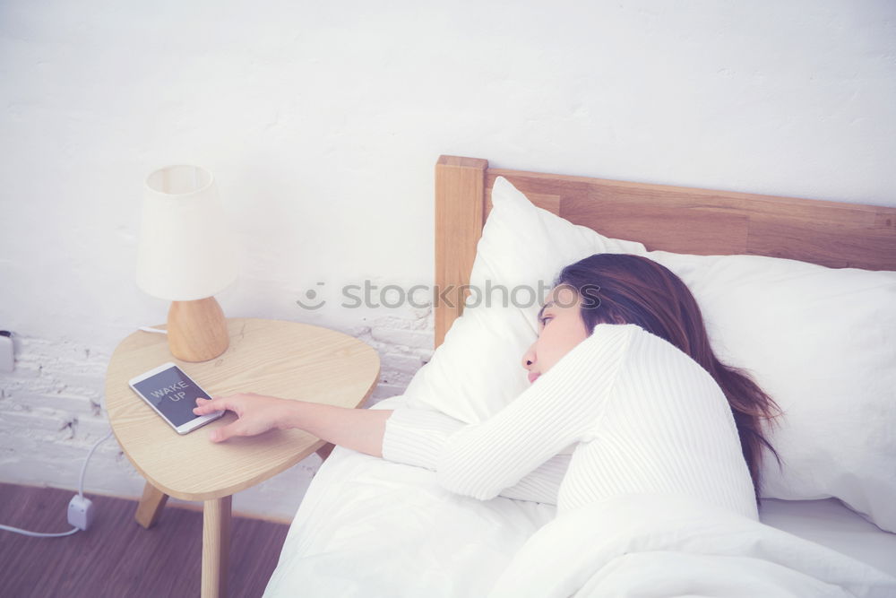 Similar – Young woman who can’t sleep is using her mobile phone